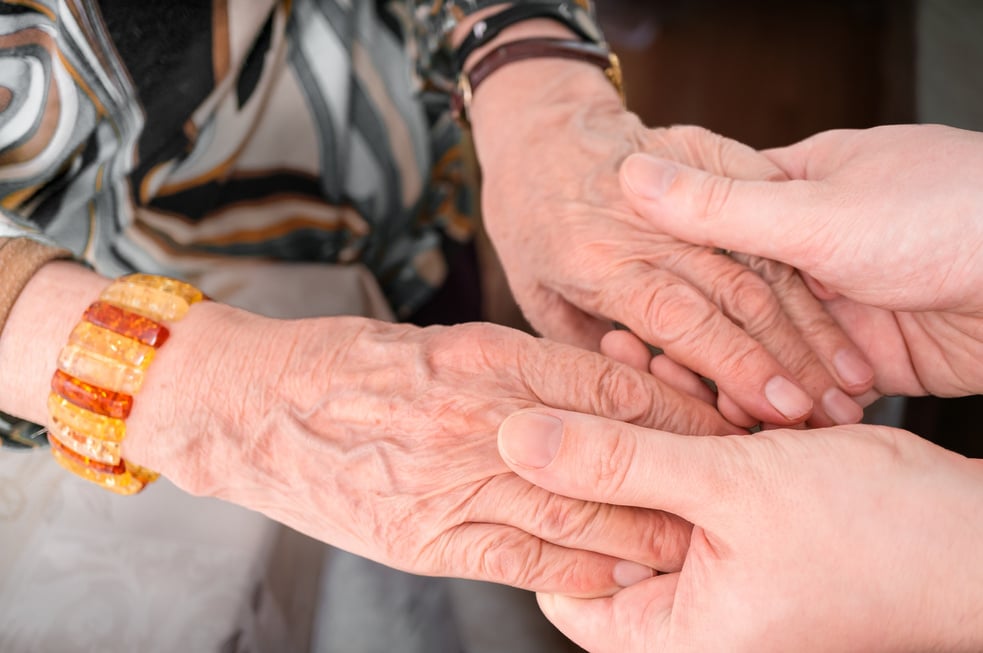 Senior or eldery assistance concept. Holding hands of senior woman.